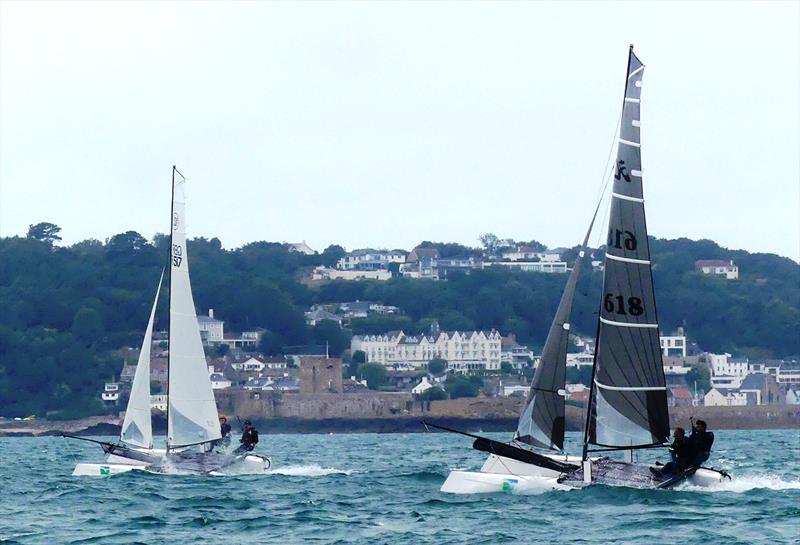 Round Jersey '21 - Wildcats 517 Andy Hart and Michael Kinross, 618 Adrian Jesson and Steve Longstaffe photo copyright RCIYC taken at Royal Channel Islands Yacht Club and featuring the Hobie Wild Cat class