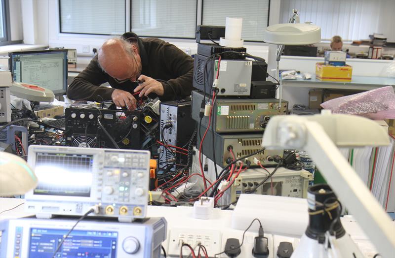 Engineers working at ICOM UK photo copyright Mark Jardine taken at  and featuring the  class
