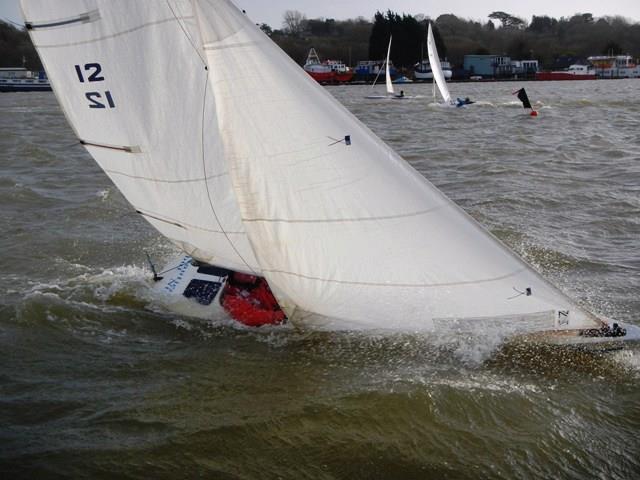 Robin Ebsworth under the spray during Piers' January Jacket Illusion event at Bembridge photo copyright Mike Samuelson taken at Bembridge Sailing Club and featuring the Illusion class