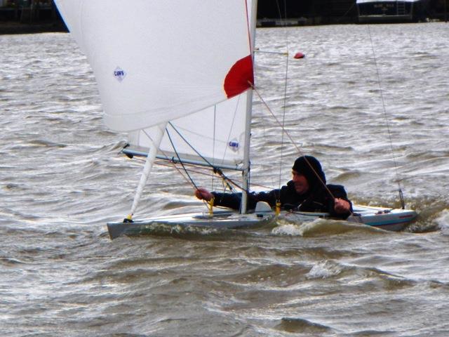 Mark Downer powering down the run during Piers' January Jacket Illusion event at Bembridge photo copyright Mike Samuelson taken at Bembridge Sailing Club and featuring the Illusion class