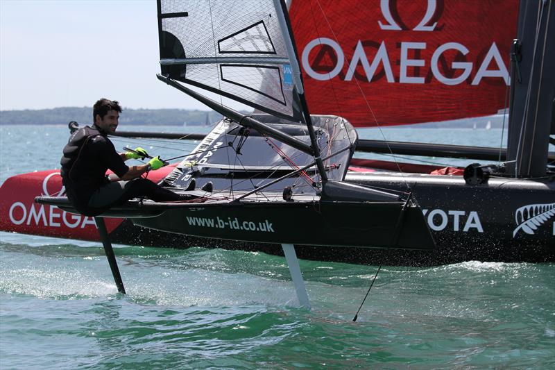 Emirates Team New Zealand AC45 fly-by on day 1 of the International Moth UK Nationals photo copyright Mark Jardine taken at Stokes Bay Sailing Club and featuring the International Moth class