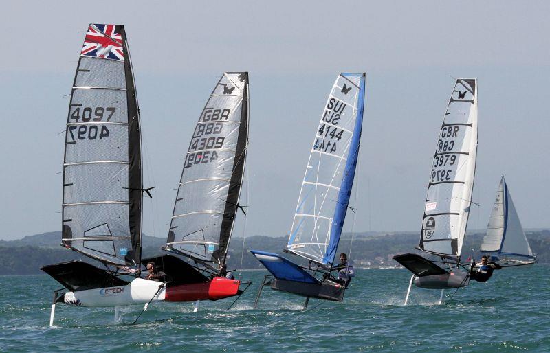 A tight finish on day 3 of the 2015 International Moth UK Nationals at Stokes Bay photo copyright Mark Jardine taken at Stokes Bay Sailing Club and featuring the International Moth class