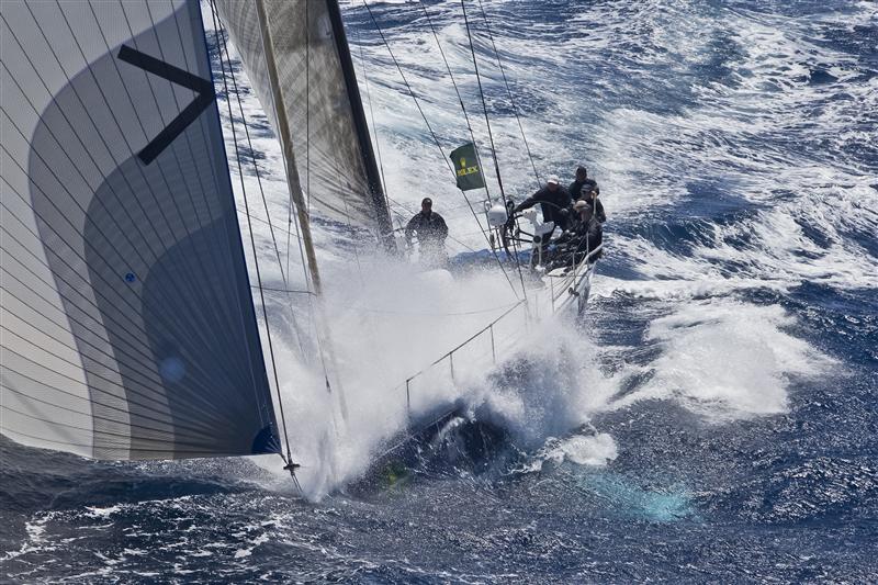 Black Jack buries the bow as she blasts south on day 2 of the 68th Rolex Sydney Hobart photo copyright Carlo Borlenghi / Rolex taken at Cruising Yacht Club of Australia and featuring the IRC class