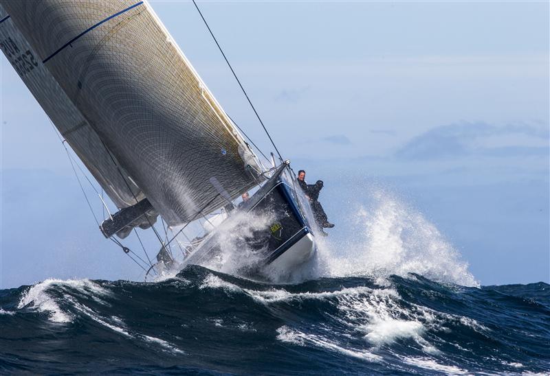 Peter Harburg's Black Jack faces steep seas & a brisk southwesterly off Tasman Island during the 68th Rolex Sydney Hobart photo copyright Daniel Forster / Rolex taken at Cruising Yacht Club of Australia and featuring the IRC class