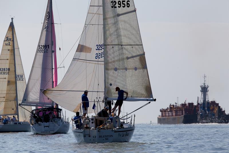 Ken King's Sabre 38 Quintette (far left) fights through a calm spot to lead a group of three Pursuit Class boats out the jetties on day 2 at 2014 Sperry-Top Sider Charleston Race Week photo copyright Meredith Block / 2014 Sperry Top-Sider Charleston Race Week taken at Charleston Yacht Club and featuring the IRC class