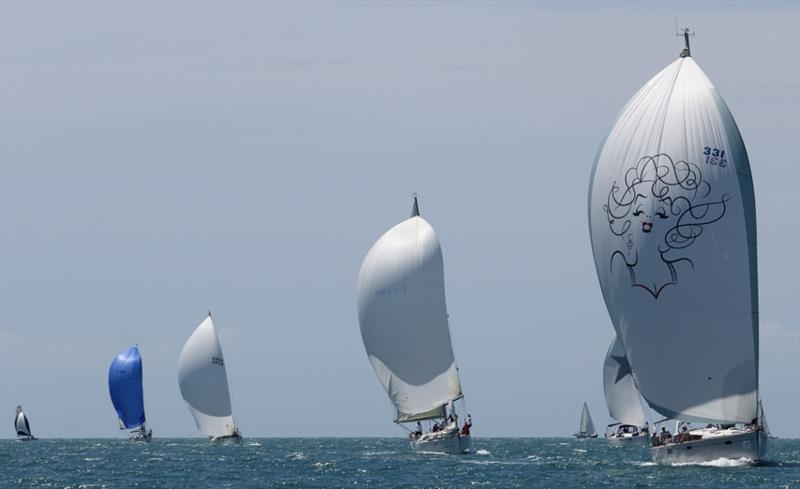 Geoff and Vicki Player's Silver Minx leads the Crusiing Divison 1 fleet on day 2 of SeaLink Magnetic Island Race Week photo copyright Tracey Johnstone taken at Townsville Yacht Club and featuring the IRC class