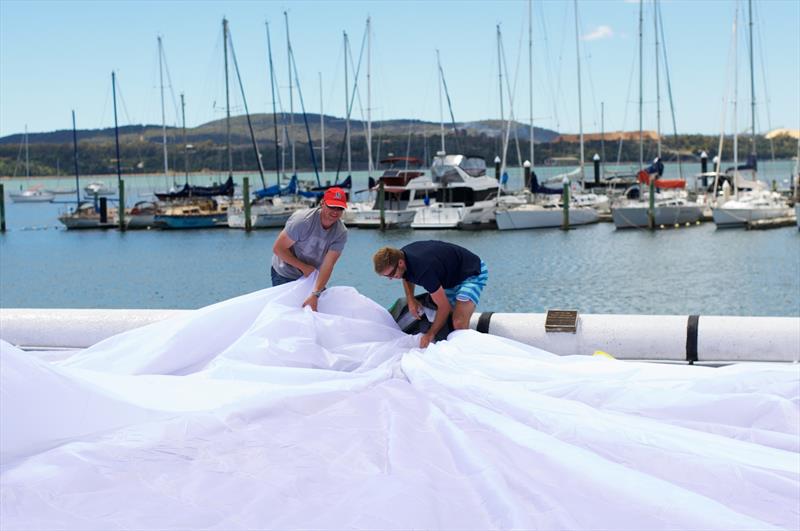 Crew packing sails at the Tamar Yacht Club at Beauty Point ahead of the National Pies Launceston to Hobart Race photo copyright Dane Lojek taken at Derwent Sailing Squadron and featuring the IRC class