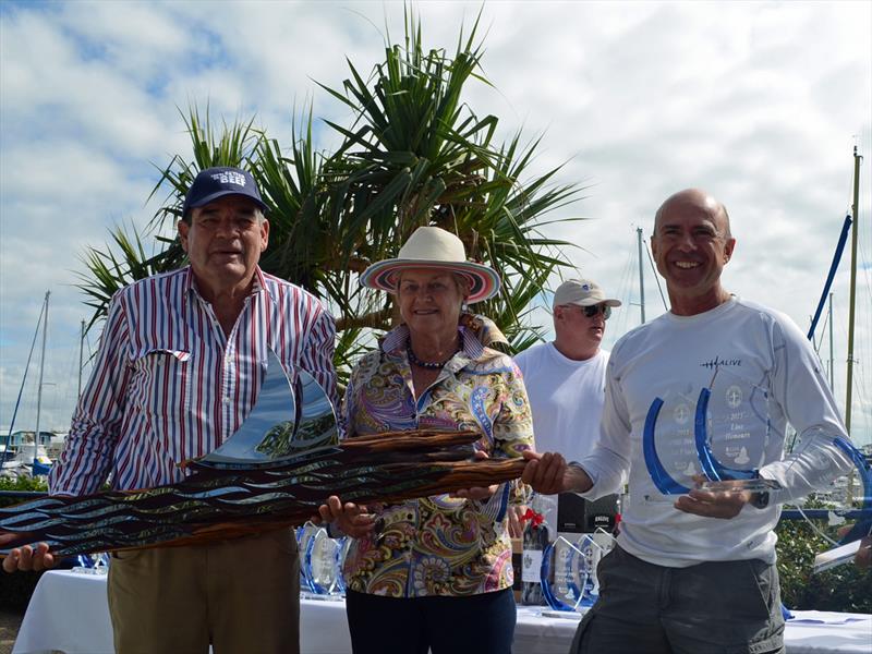 Duncan Hine (3rd from right) collects the line honours trophy from Richard and Libby Wilson for the Club Marine Brisbane to Keppel Tropical Yacht Race photo copyright Keppel Bay Marina taken at Royal Queensland Yacht Squadron and featuring the IRC class