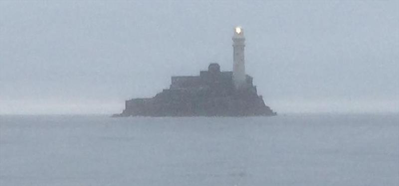 The Fastnet Rock surrounded by a calm sea at 0600 this morning during the Solo Round the Rock Race photo copyright Charles Emmett taken at  and featuring the IRC class