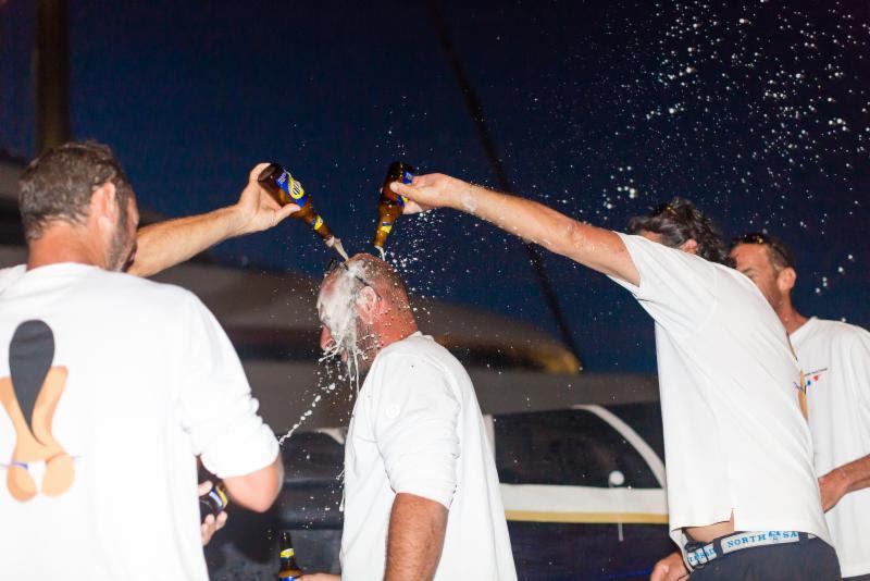 Cold beer shower for Laurent Pagès after Teasing Machine took overall win in the 4th RORC Transatlantic Race in Grenada photo copyright RORC / Arthur Daniel taken at  and featuring the IRC class