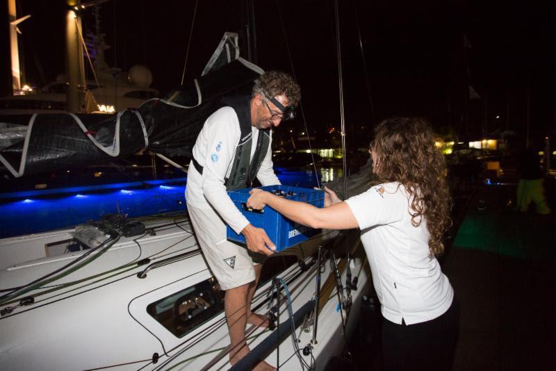 Being greeted dockside with a crate of cold beer was welcomed by the weary duo after nearly 22 days at sea  photo copyright RORC / Arthur Daniel taken at Royal Ocean Racing Club and featuring the IRC class