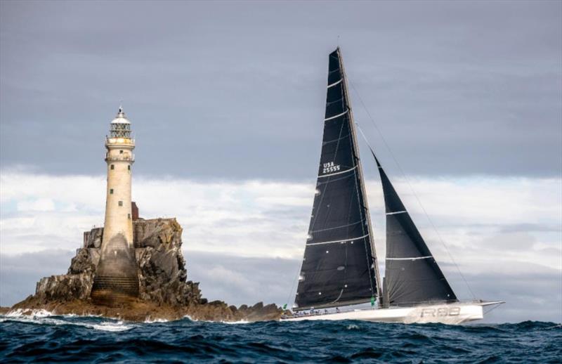 George David's Rambler 88 rounds the legendary Fastnet Rock photo copyright Rolex / Carlo Borlenghi taken at Royal Ocean Racing Club and featuring the IRC class