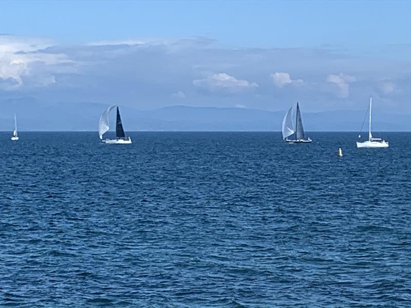 Mojito overtaking Gelert and heading to the finish in the third ISORA 2023 Welsh Coastal Race in Pwllheli photo copyright Jules Ashworth taken at Pwllheli Sailing Club and featuring the IRC class