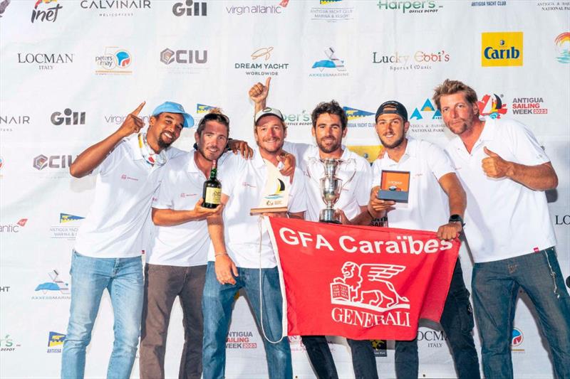 Lifting the Governor General Cup for CSA 5 - Tristan Marmousez's GFA Caraïbes - La Morrigane (FRA) - Antigua Sailing Week photo copyright Visual Echo taken at Antigua Yacht Club and featuring the IRC class