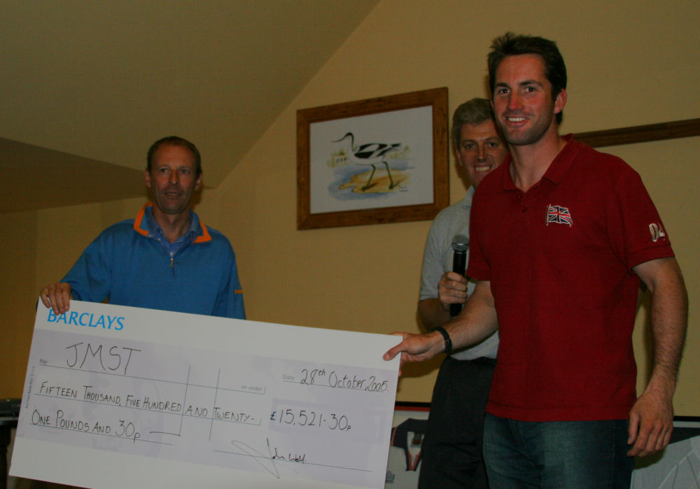 John Welch and Neil Mackley - North Sails present Patron of the JMST Ben Ainslie OBE with a cheque for total amount raised from the event during the ninth North Sails Golf Day for the John Merricks Sailing Trust photo copyright Ian Finlay / www.ianfinlay.com taken at  and featuring the JMST class