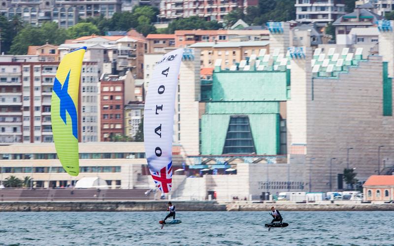 Kiteboarders race in front of the Festival Palace on day 1 of the World Cup Series Final in Santander photo copyright Pedro Martinez / Sailing Energy / World Sailing taken at  and featuring the Kiteboarding class