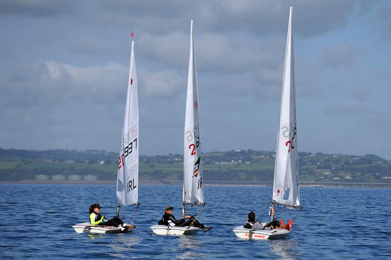 Annalise Murphy, James Espey and Darragh O'Sullivan waiting for the wind on the final day of the Zhik Irish Laser Nationals photo copyright Nicholas Haig taken at Ballyholme Yacht Club and featuring the ILCA 7 class