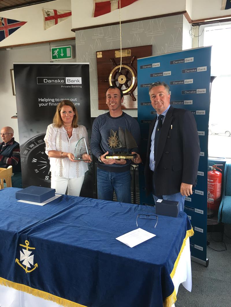 Gareth Flannigan with Event Organiser Claire Storey and Rear Commodore Ruan O'Tiarnaigh at the Danske Bank Private Banking Irish Laser Masters Championship photo copyright Mark Mackey taken at Ballyholme Yacht Club and featuring the ILCA 7 class