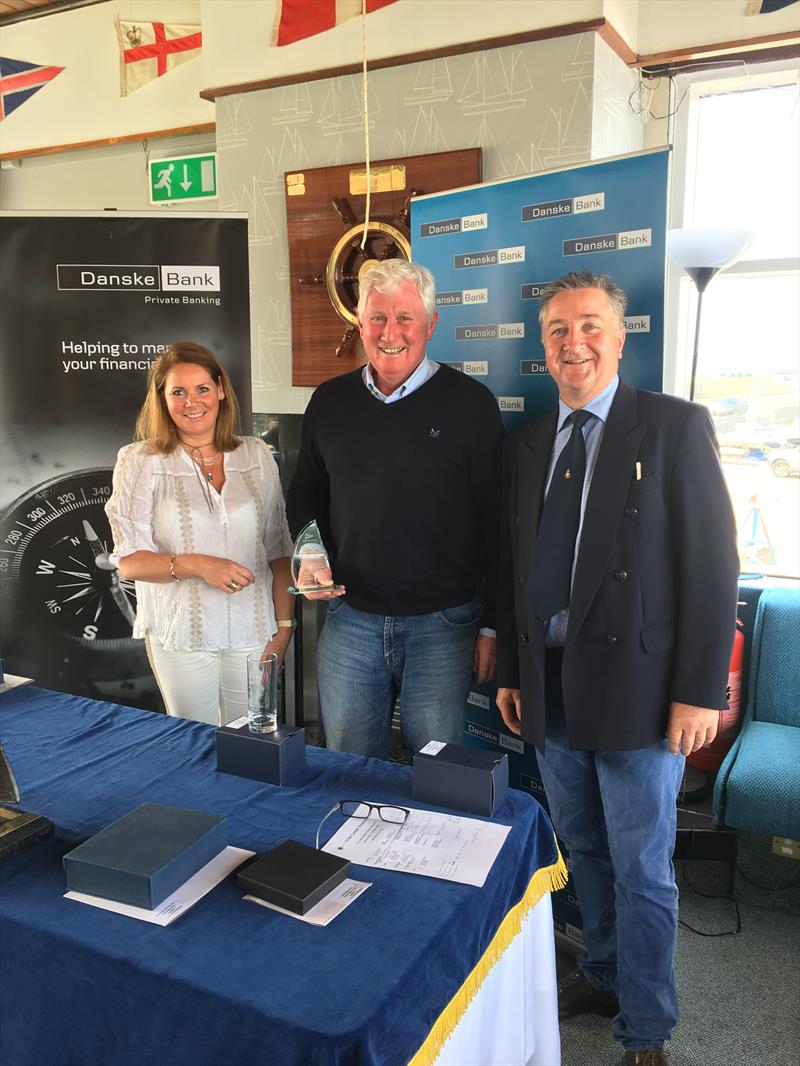  Grand Master Charlie Taylor with Event Organiser Claire Storey and Rear Commodore Ruan O'Tiarnaigh at the Danske Bank Private Banking Irish Laser Masters Championship photo copyright Mark Mackey taken at Ballyholme Yacht Club and featuring the ILCA 7 class