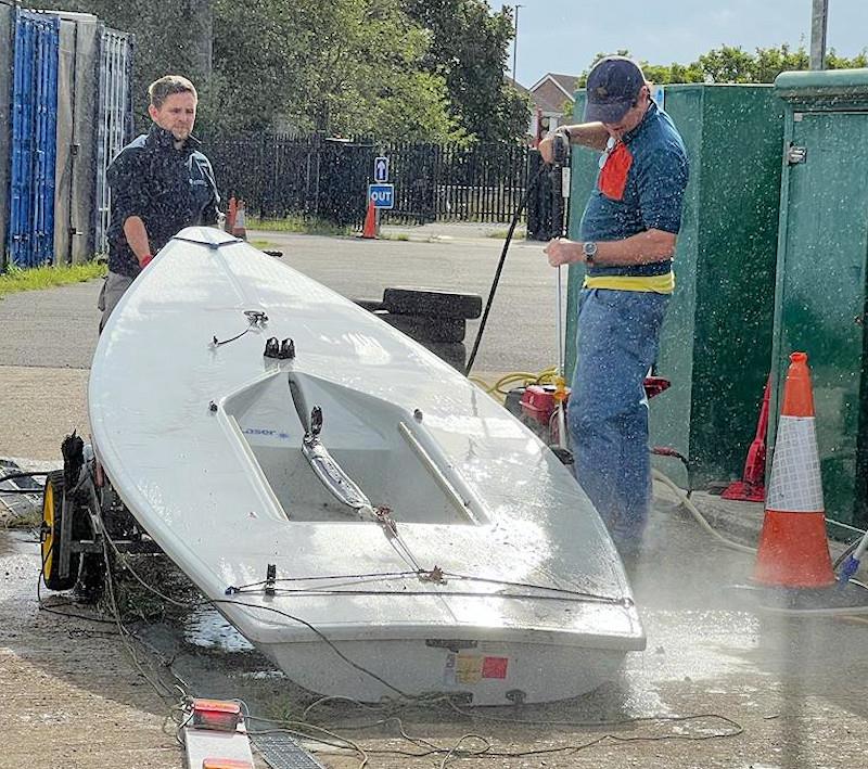 Cleaning off an ILCA photo copyright QMSC taken at Queen Mary Sailing Club and featuring the ILCA 7 class