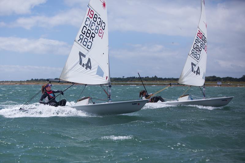 Abby Childerley and Eve Kennedy (Parkstone YC) enjoying the challenge during the Royal Lymington Yacht Club Youth Laser Open photo copyright Christine Spreiter taken at Royal Lymington Yacht Club and featuring the ILCA 4 class