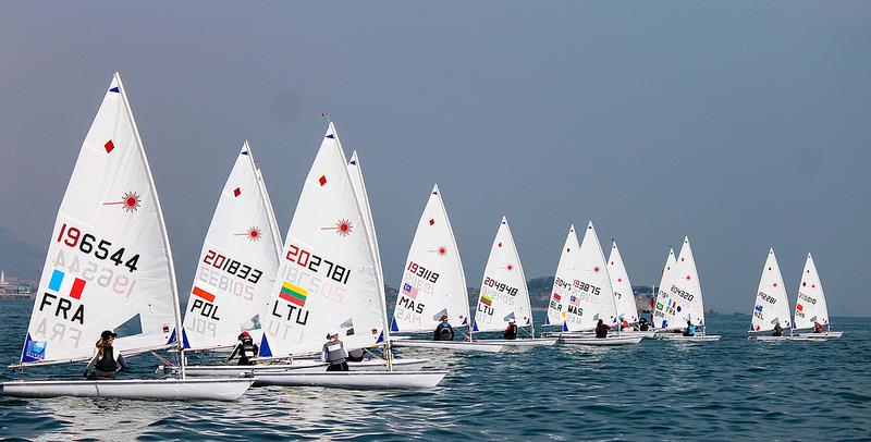 Laser Radial fleet on day 4 at the ISAF Sailing World Cup Qingdao photo copyright ISAF taken at  and featuring the ILCA 6 class