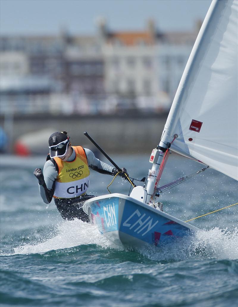 Lijia Xu (CHN) wins gold in Women's One Person Dinghy at the London 2012 Olympic Sailing Competition photo copyright onEdition taken at Weymouth & Portland Sailing Academy and featuring the ILCA 6 class