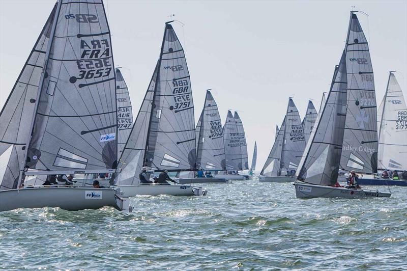 Upwind after the start on day 2 of the SB20 Worlds at Cowes  photo copyright Jennifer Burgis taken at Royal Yacht Squadron and featuring the SB20 class