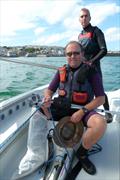 Simon Ashmore controls the jib with Graeme Sennen at the helm of St Ives Sailing Club's dinghy Redemption © Paul Maskell