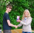 2024 Mermaid Trophy GAMES 4 at Guildford: Celia presents the Junior prize to Oliver Stollery © Martin Crysell