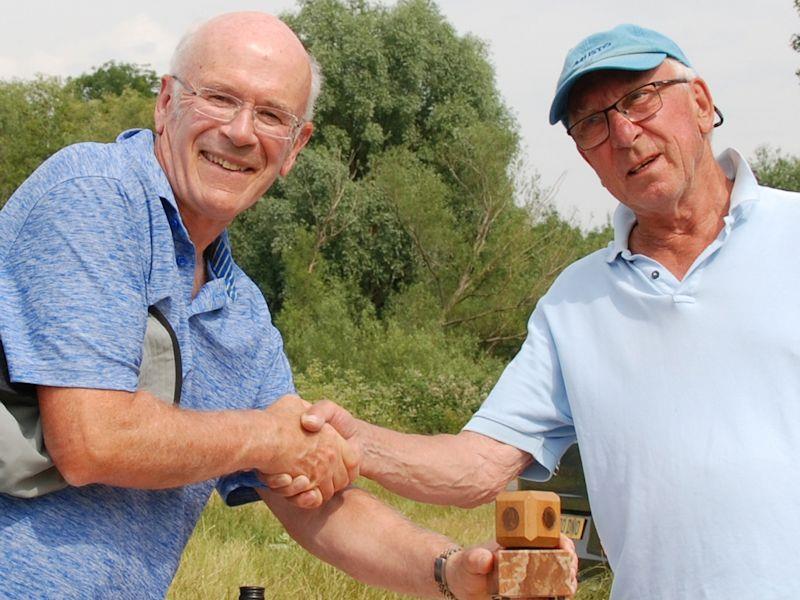 Nigel Barrow (L) receives trophy from RO Martin Crysell - Marblehead GAMES 5 event and Halfpenny Trophy at Abbey Meads photo copyright Roger Stollery taken at Guildford Model Yacht Club and featuring the Marblehead class