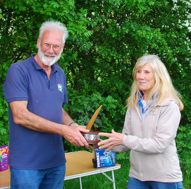 2024 Mermaid Trophy GAMES 4 at Guildford: 4th placed Barrie Martin collecting his Vic Cooney 'Grand Master' Trophy and prize from Celia photo copyright Martin Crysell taken at Guildford Model Yacht Club and featuring the Marblehead class