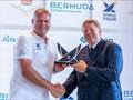 Bermuda Gold Cup 2023: World Match Racing Tour Executive Director James Pleasance presenting a WMRT recognition award to RBYC Commodore Craig Davis © Ian Roman / WMRT