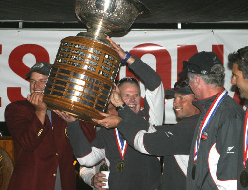 Dean Barker (left) in Crimson Blazer, and his team hoist the Congressional Cup photo copyright Rich Roberts taken at Long Beach Yacht Club and featuring the Match Racing class