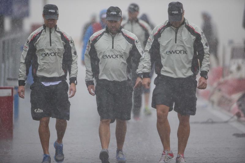 eWork Sailing Team in the rain at the Monsoon Cup in Malaysia photo copyright AWMRT / onEdition taken at  and featuring the Match Racing class