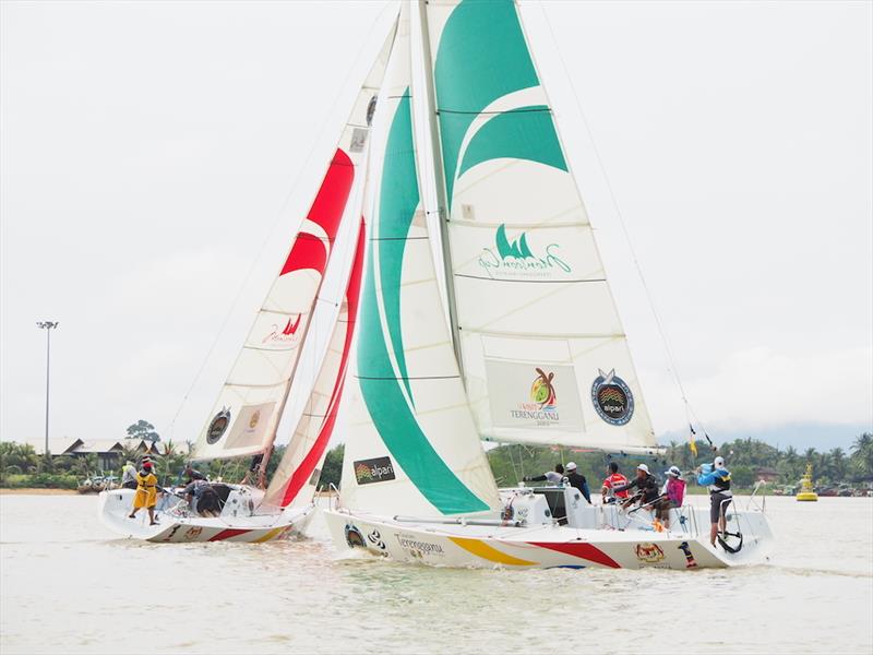 Jeremy Koo's Sime Darby Foundation/1Malaysia Match Racing Team (left) in the final of the Liga Layar Malaysia 2014 Pulau Duyong match racing photo copyright Norzuhaira Ruhanie taken at  and featuring the Match Racing class