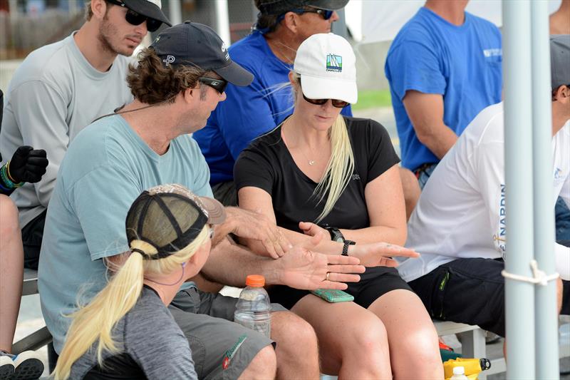 The USA's Dave Perry (left facing) talks tactics with Canada's Elizabeth Shaw while Shaw's crew, Antilles School junior sailor, Paige Clarke (lower left), from St. John, look on during day 1 of the 2015 Carlos Aguilar Match Race photo copyright Dean Barnes taken at St. Thomas Yacht Club and featuring the Match Racing class