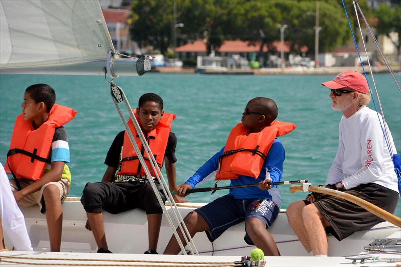 The USA's Dave Dellenbaugh (far right) mentors young sailors from Addelita Cancryn Jr. High in the Carlos Aguilar Match Race Youth Regatta photo copyright Dean Barnes taken at St. Thomas Yacht Club and featuring the Match Racing class