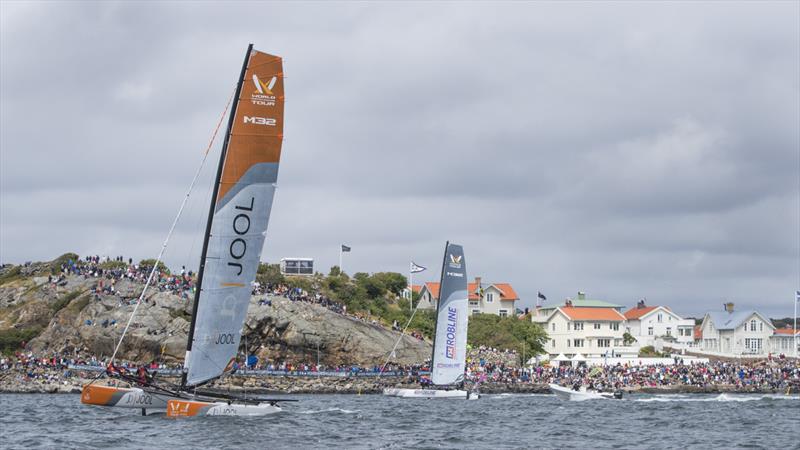 Phil Robertson, China One Ningbo (orange boat), vs Taylor Canfield, US One (grey boat) in the final of the GKSS Match Cup Sweden photo copyright Ian Roman / WMRT taken at Royal Gothenburg Yacht Club and featuring the Match Racing class