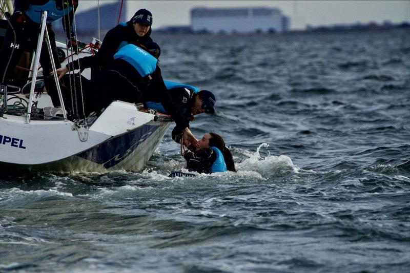 Juliet Costanzo (AUS) and the Easy Tiger Racing retrieving a crew member after falling overboard at 2022 Women's Match Race Denmark photo copyright WMRT taken at  and featuring the Match Racing class