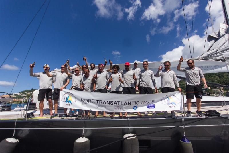Crew of Windfall celebrate dockside at Port Louis Marina after the RORC Transatlantic Race photo copyright Arthur Daniel & Orlando K Romain / RORC taken at  and featuring the Maxi class