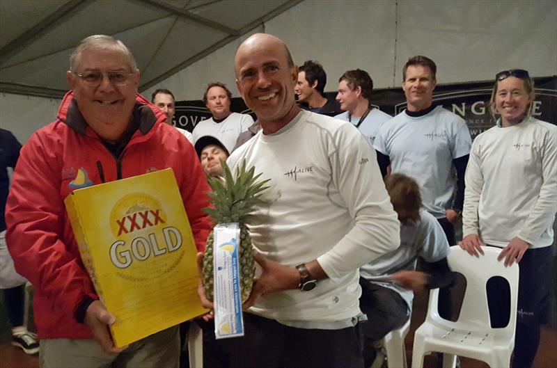RQYS Vice Commodore Mark Gallagher presents the customary pineapple and XXXX to Duncan Hine in the Brisbane to Keppel Yacht Race photo copyright B2K media taken at  and featuring the Maxi class