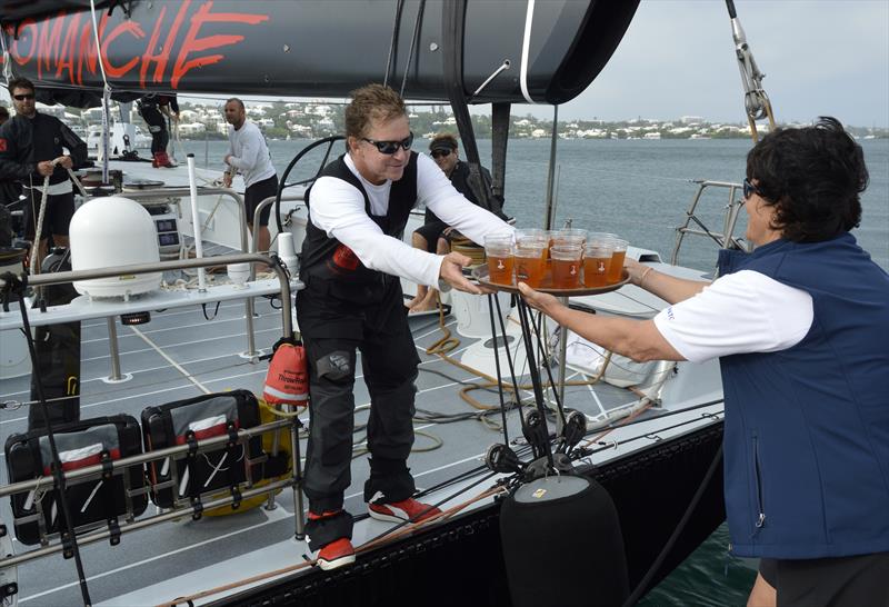 Dark 'n Stormies all round! Leatrice Oatley, Commodore of the Royal Bermuda YC hands Ken Read, skipper of Comanche crew rations to celebrate their record run in the Newport Bermuda race - photo © Barry Pickthall / PPL