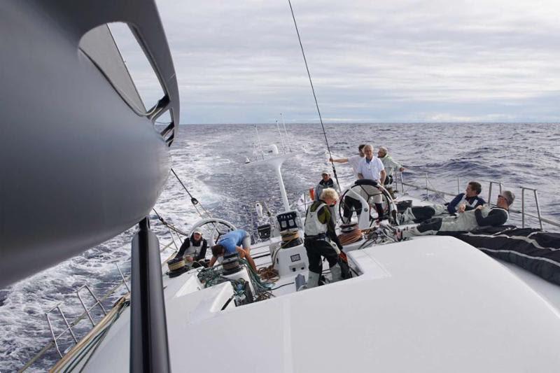 After a night of demanding sail changes; Mike Slade at the helm of Maxi, Leopard 3 in the RORC Transatlantic Race - photo © Leopard3 / Kolja Frase