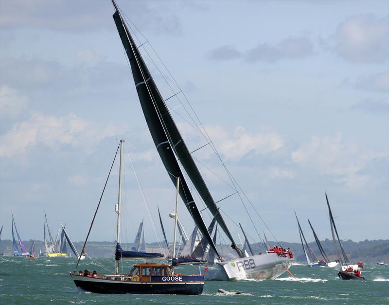 The mighty Rambler 88 negotiates traffic at Hurst after the Rolex Fastnet Race start photo copyright Mark Jardine / YachtsandYachting.com taken at Royal Ocean Racing Club and featuring the Maxi class