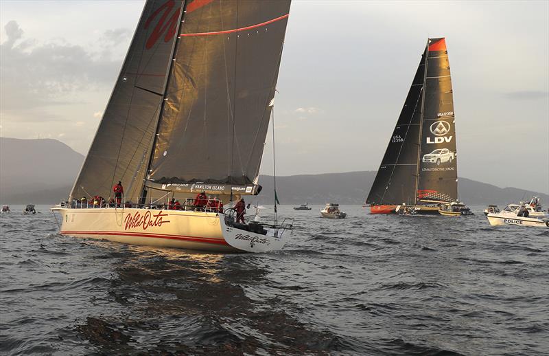 Wild Oats XI gets new breeze and with her skinny hull form begins to rein in LDV Comanche's lead - photo © Crosbie Lorimer