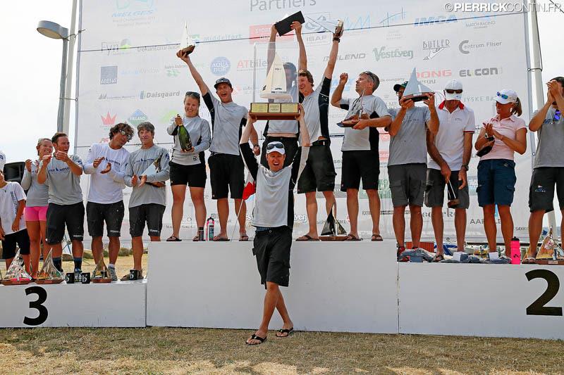 Top 3 teams at the 2015 Melges 24 World Championship prize giving photo copyright Pierrick Contin / IM24CA taken at Middelfart Sailing Club and featuring the Melges 24 class