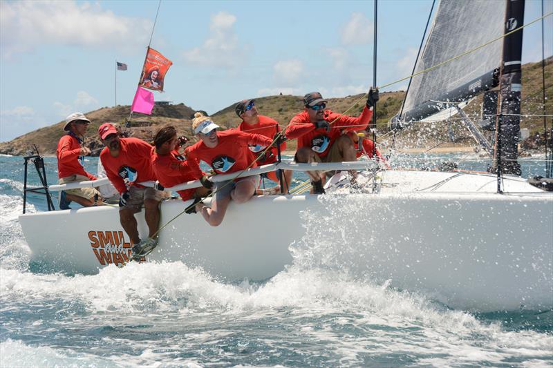 Riding the rail about Puerto Rico's Jamie Torres' Melges 32, Smile and Wave on day 3 of the 41st St. Thomas International Regatta photo copyright Dean Barnes taken at St. Thomas Yacht Club and featuring the Melges 32 class