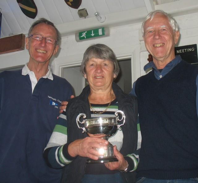 Commodore Stewart Colley presents the Porteous Cup to Sue Harris and Berry Ritchie photo copyright Richard Mourant taken at Tamesis Club and featuring the Merlin Rocket class