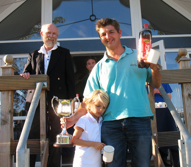 David Vines with the Merlin Autumn Cup and daughter Sophie who crewed on Sunday at the Tamesis Autumn Regatta photo copyright John Dunkley taken at Tamesis Club and featuring the Merlin Rocket class